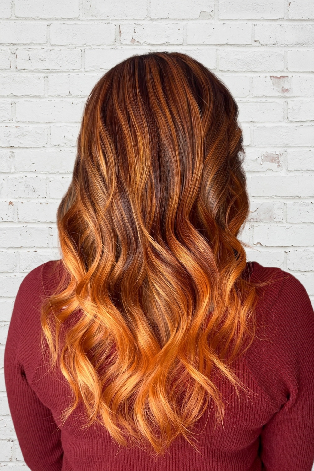 Warm copper and auburn balayage on long wavy hair, Draper Utah hair colorist Laila Grigley.