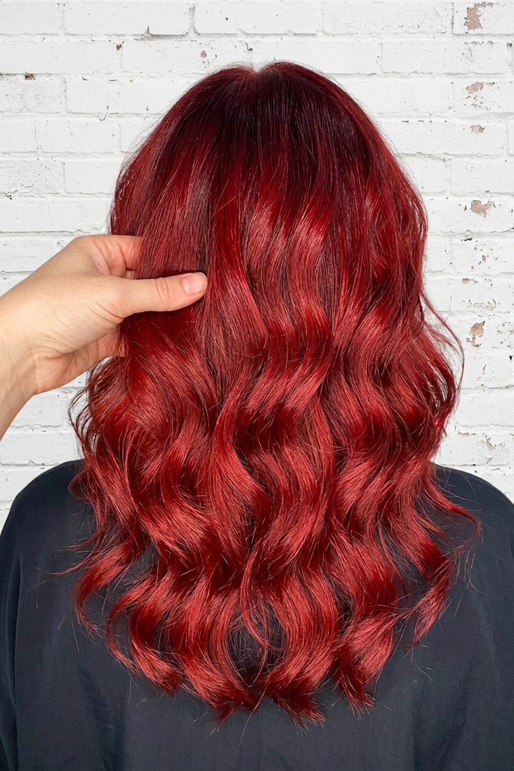 Deep cherry red hair color on a textured bob, vivid red colour by Wicked Hair in Utah.