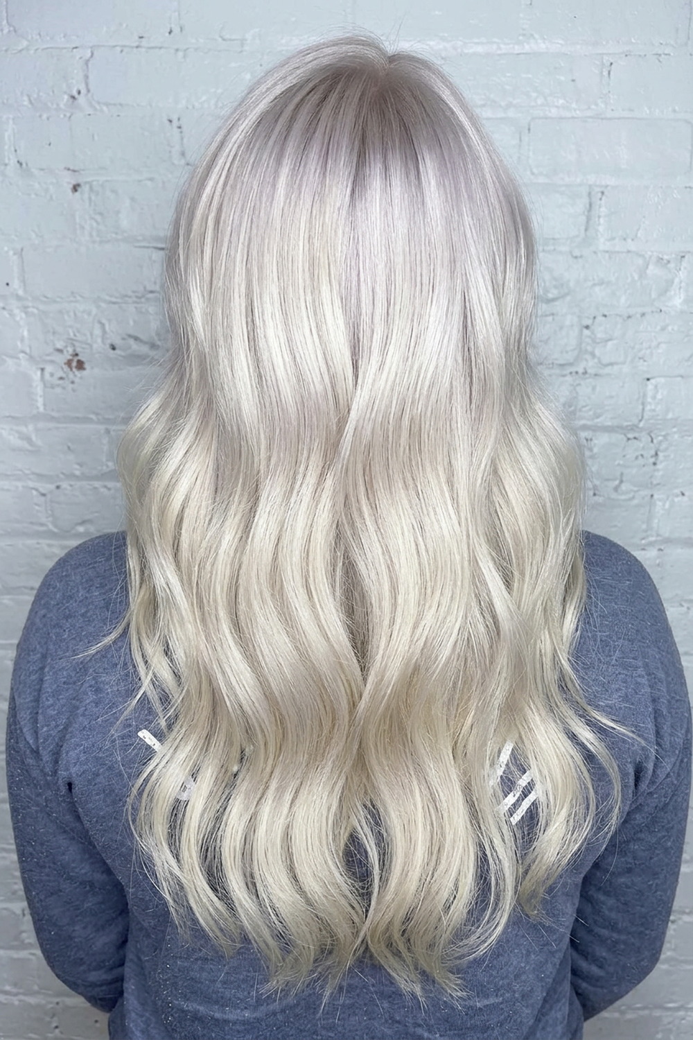 Icy platinum blonde with a soft shadow root, cool toned blonde colour work in Utah.