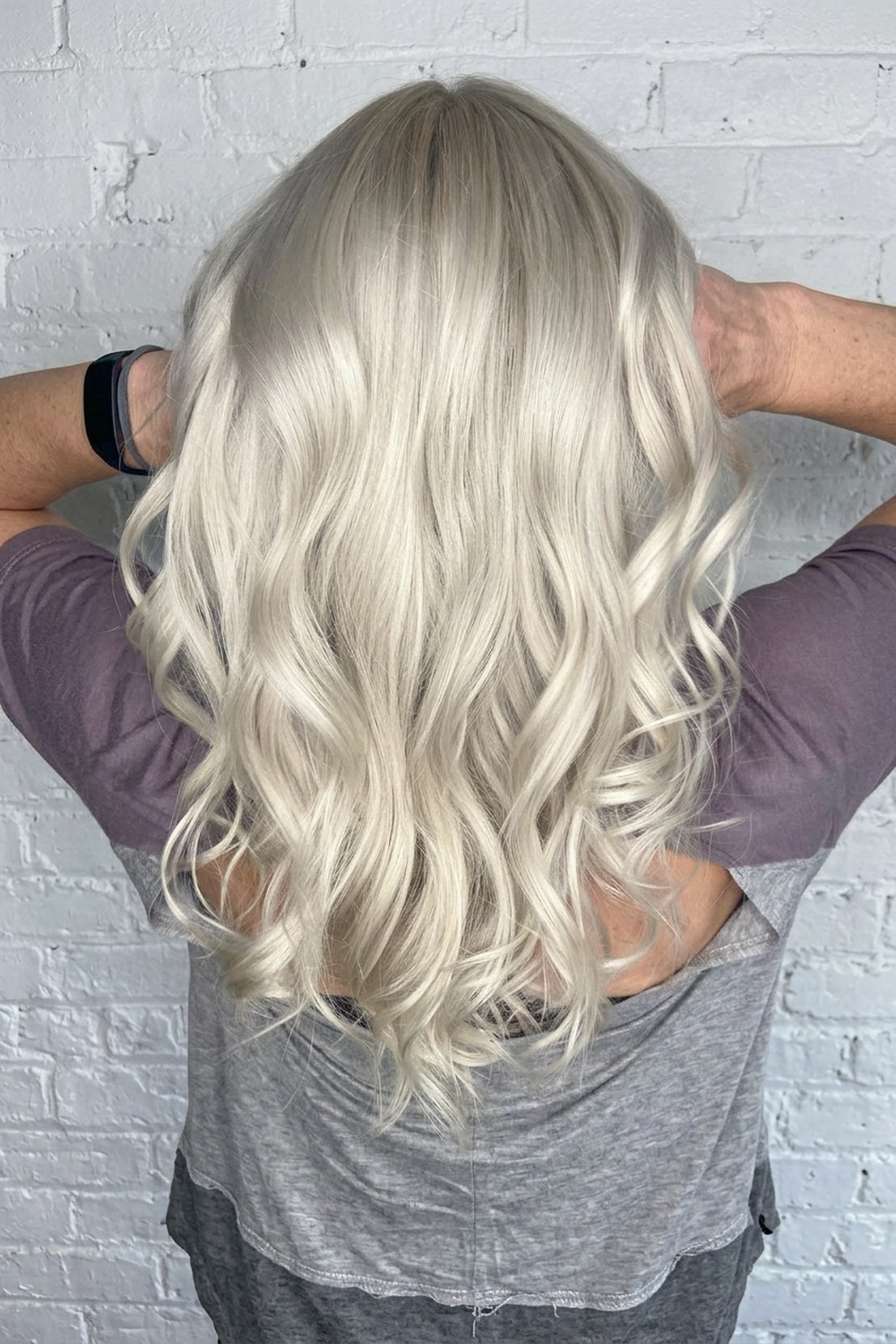 Icy silver blonde with soft waves, cool toned blonde colour work by Wicked Hair, Utah.
