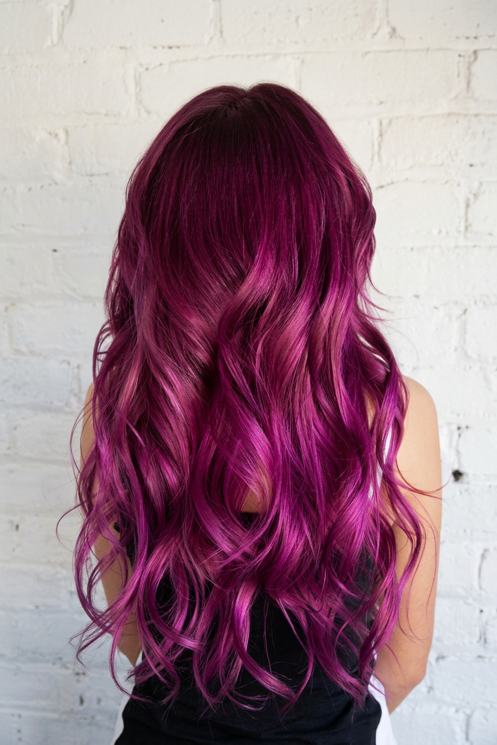 Deep plum roots melting into vivid magenta lengths, exotic hair colour by Wicked Hair, Utah.
