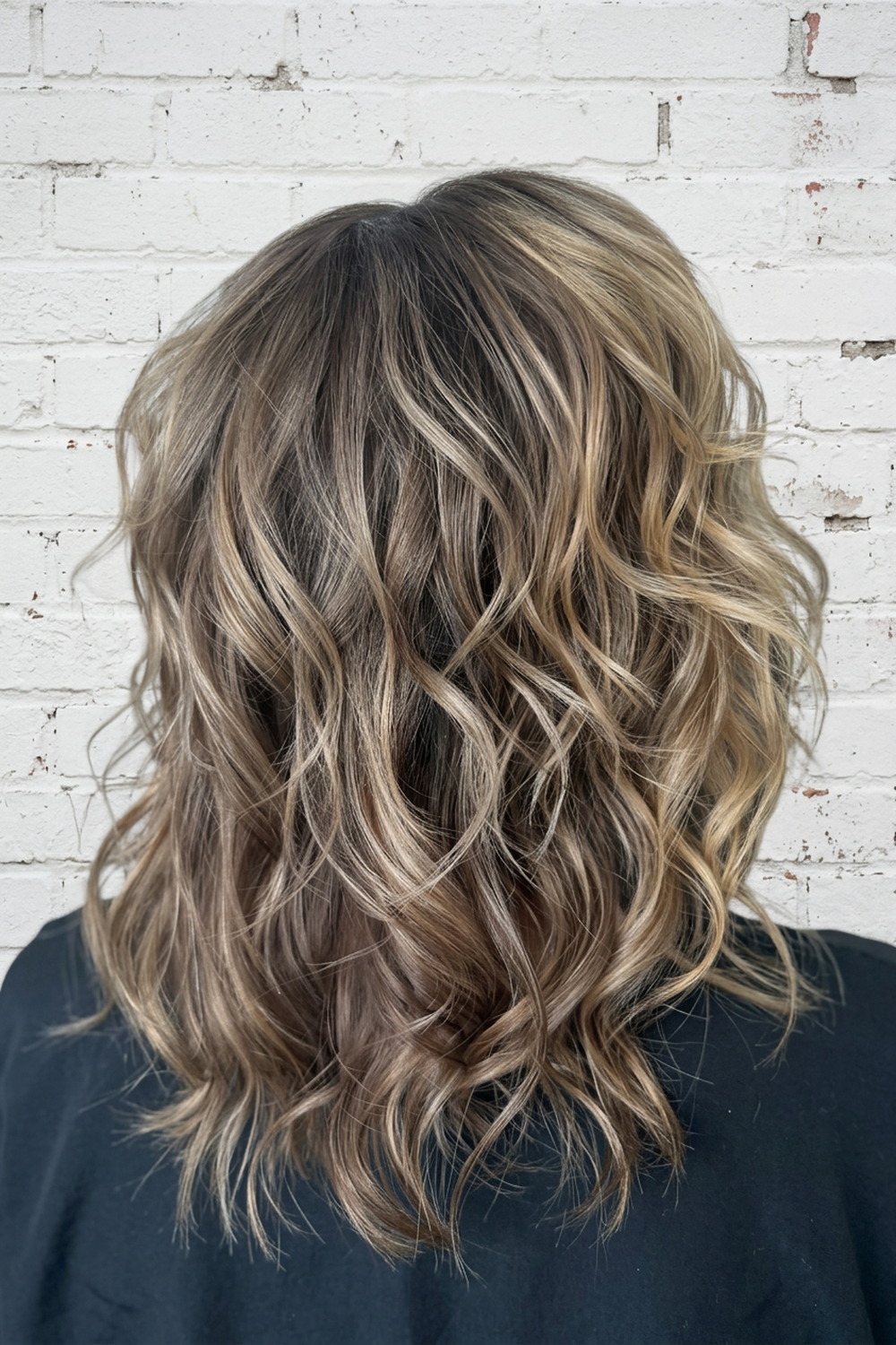 Sandy bronde textured shag with soft waves, lived-in colour by Laila Grigley, Utah.